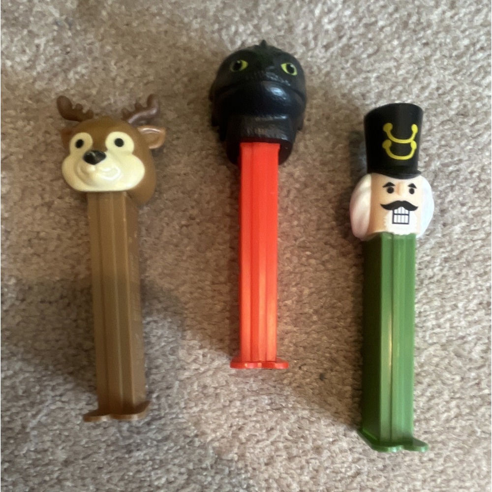 Lot of 3 PEZ Candy Dispensers: Reindeer,‎ Black Beast/Monster & Nutcracker